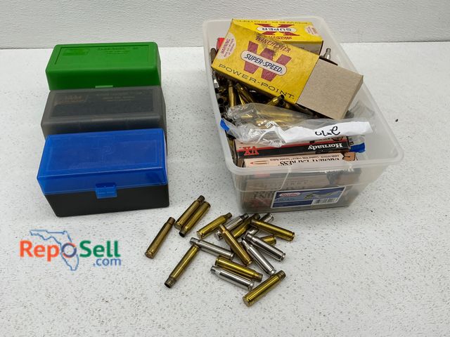 Lot 31-1452 - Includes three plastic rifle ammo boxes in green, black, and blue colors, and a plastic container wi...