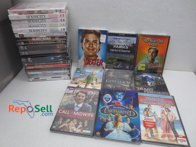 Lot 31-6345 - Lot of DVDs - Most Still Sealed/Some Series: Sex &amp; The City, 24, Enchanted, Transformers, 40yr O...