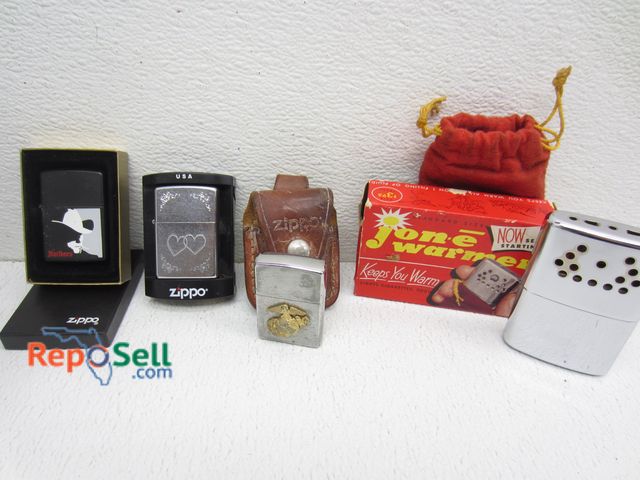 Lot 31-7488 - Zippo Lighters &amp; Glass Skull Decanter
