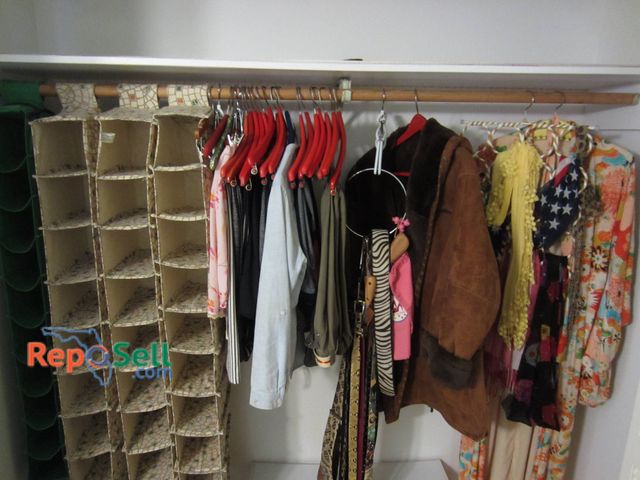 Lot 31-9042 - Various Clothing Items, Leather Jacket, Genuine Snake Skin Belt, And Accessories With (4) Shoe Racks