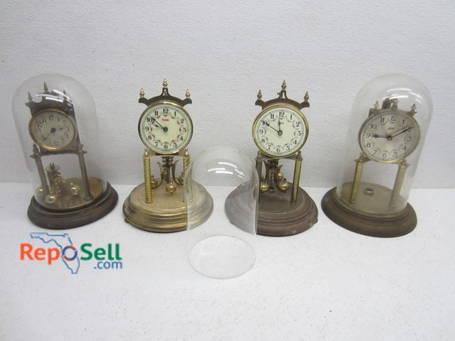 Lot 31-9182 - (4) Brass Mantel Clocks &amp; (3) Glass Domes, Tote Included