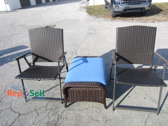 Lot 31-1225 - (2) Folding Patio Chairs and Ottoman