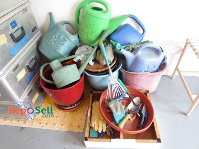 Lot 31-9143 - Gardening items, including plastic watering cans with floral designs, a variety of terracotta and pl...