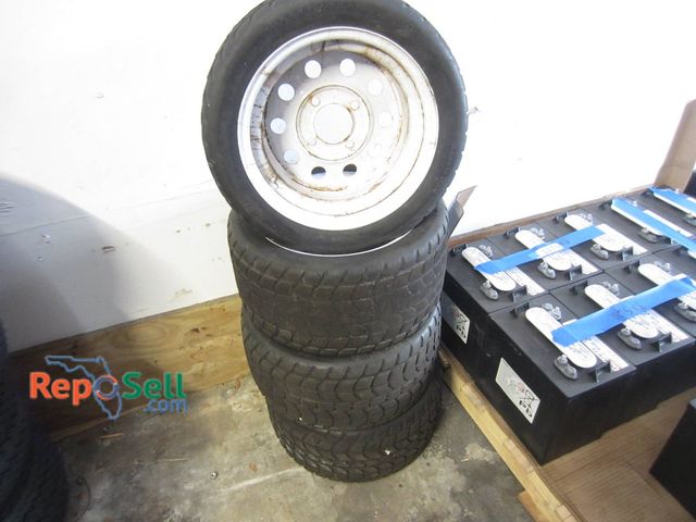 Lot 31-1274 - (4) 4-Lug Steel Wheels With 18x8.5-8 NHS Solid Rubber Tires