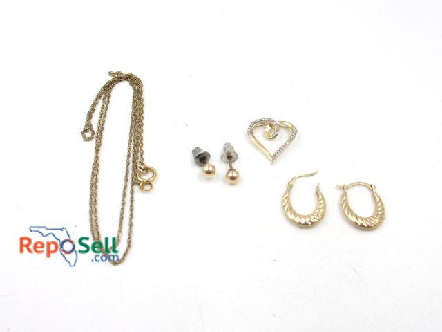 Lot 31-5001 - Jewelry Lot: 10K Pendant, (2) Earrings 1.29g total (weighed without earring backs) and 8K Chain .82g