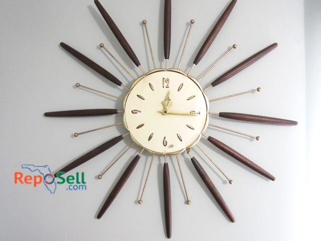 Lot 31-9024 - Starburst Wall Clock By Freeman Clock Company, Metal And Wood Construction, 27 Inches.