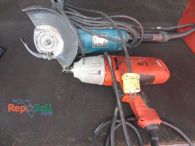 Lot 31-1367 - A Milwaukee Heavy-Duty Drill And A Makita Angle Grinder. Both Tools Are Corded And Operate On A Stan...