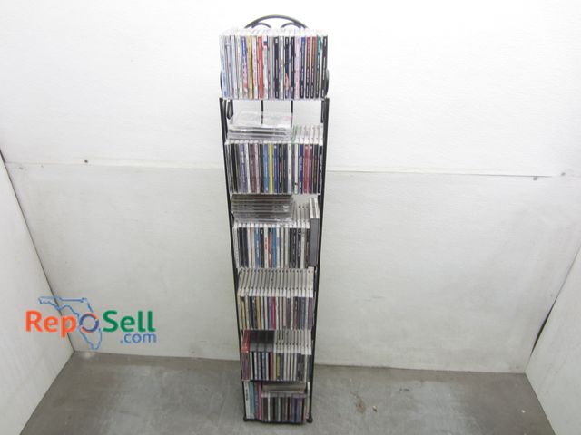 Lot 31-8524 - Approx (125) CD's With Stand: Elton John, Celine Dione, Whitney Houston etc
