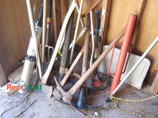 Lot 31-2132 - Lot of yard tools, well pump, post driver, axes etc