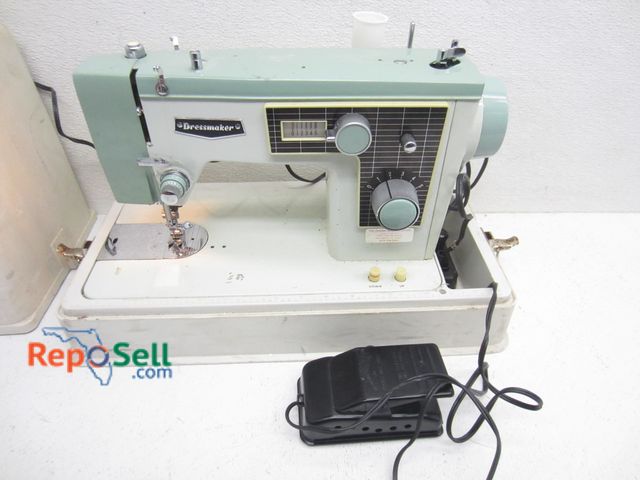 Lot 31-6066 - Dressmaker Sewing Machine #83476 With Cover - Power On, Ran When Tested