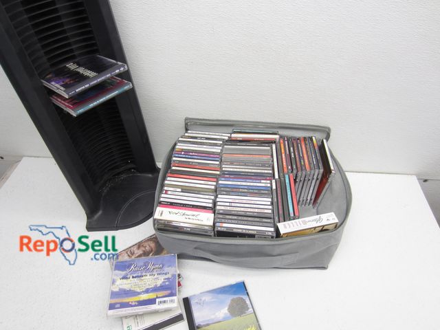 Lot 31-1135 - Approx (88) CD's and Plastic Stand