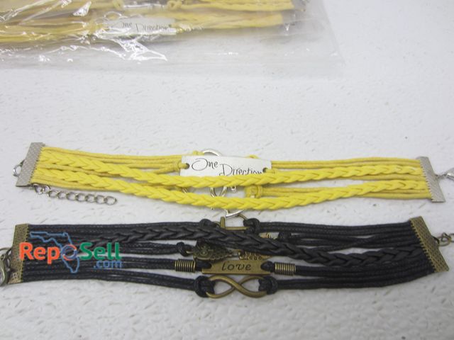 Lot 31-4485 - (24) Leather Style Charm Bracelets: One Direction &amp; Love