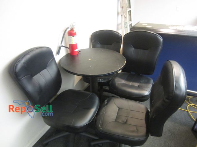 Lot 31-2110 - (4) Black Chairs, Small Table and Extinguisher