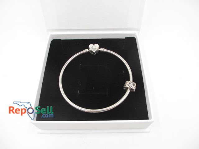 Lot 31-6010 - Retired Pandora Wishful Heart Bangle Bracelet with one charm