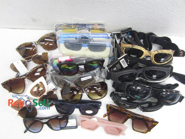 Lot 31-1213 - (10) Pairs Pugs Action Sports Adjustable Goggles, (14) Pairs Assorted Sunglasses, (3) Flip Up Sungla...