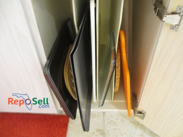 Lot 31-1176 - Contents Of Cupboard: Baking Sheets, Cutting Boards etc