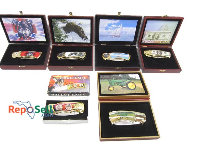 Lot 31-5409 - (6) Boxed Knives: Variety of Designs: Sailboat, John Deere, Eagle, etc.