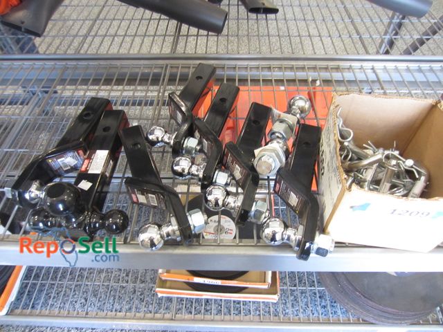 Lot 31-1209 - (7) New hitches, various balls, pins