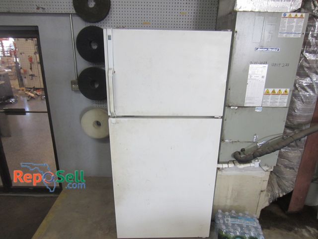 Lot 31-1055 - GE refrigerator - cools and freezes, 64 in. by 30 in. by 31 in.
