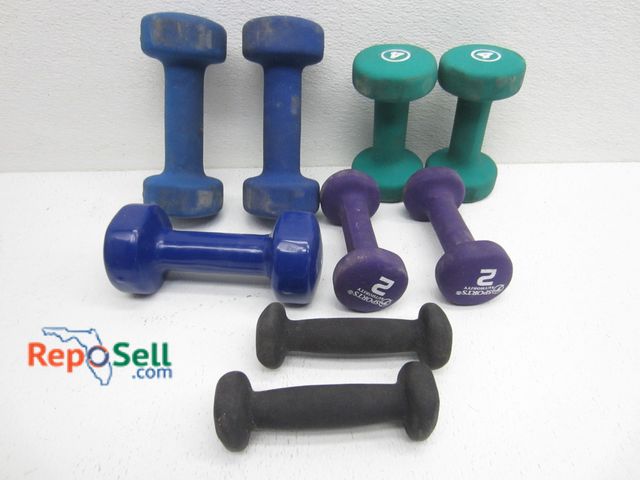 Lot 31-1116 - Four pairs of dumbbells, including 1 lb, 2 lb, 4 lb, and 5 lb, plus one extra 5 lb dumbbell