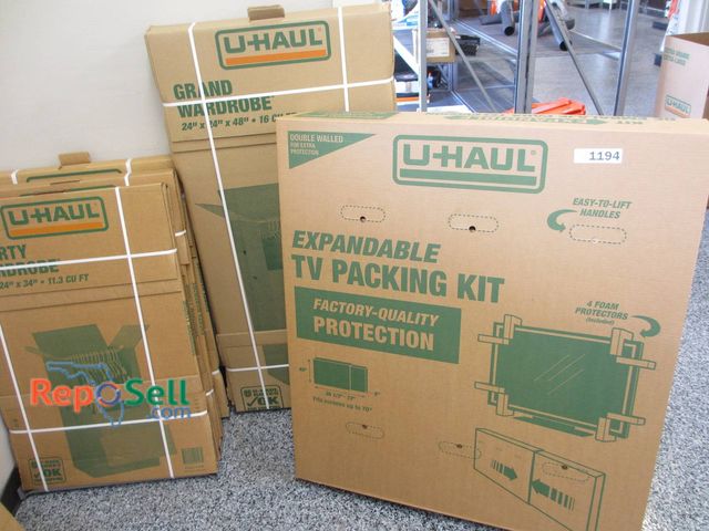 Lot 31-1194 - New Uhaul Moving Boxes Including Two Large And Small Wardrobe Boxes, And One Large Expandable TV Pac...