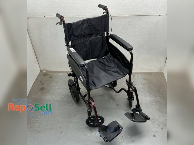 Lot 31-1462 - Medline transport wheelchair featuring a lightweight metal frame with burgundy finish. Includes padd...
