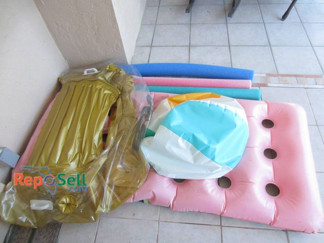 Lot 31-8603 - Pool Floats Including Hobie Gold Lounger, Pink Air Mattress, Noodles, Inflatable Beach Ball