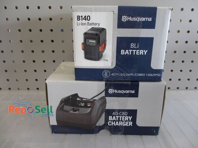 Lot 31-1168 - New Husqvarna B140 Lithium-Ion Battery And 40-C80 Battery Charger. Both Items Are In Original Packag...