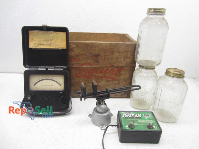 Lot 31-9496 - Vintage squirt box, (3) large mason jars, fence energizer, zero corrector.