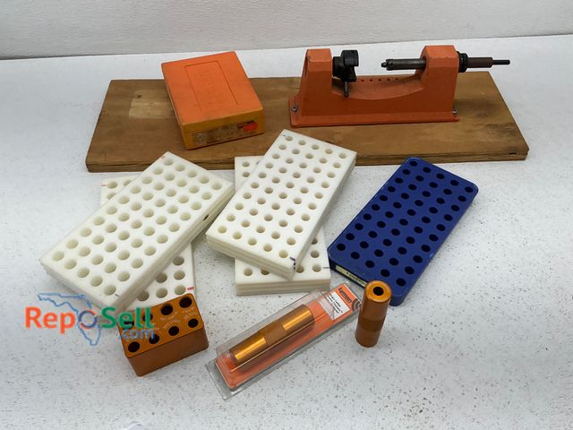 Lot 31-1458 - An orange cast iron Lyman reloading trimmer mounted on a wooden base with tension adjustment, Sincla...