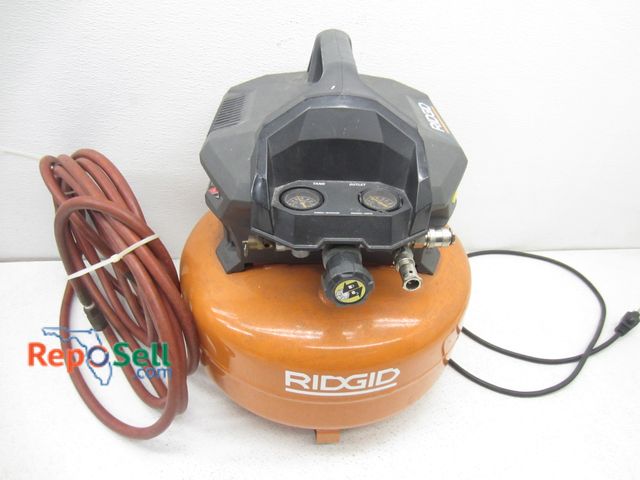 Lot 31-9176 - Ridgid 6 Gallon Air Compressor With Hose- Power On, Builds Pressure