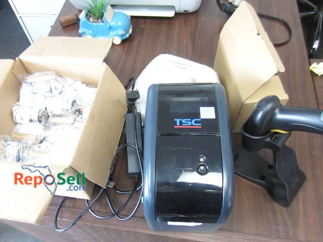 Lot 31-1304 - TSC TTP-225 Barcode Printer With Label Rolls, Ribbons, Wireless 2D Scanner Bundle Both Power On