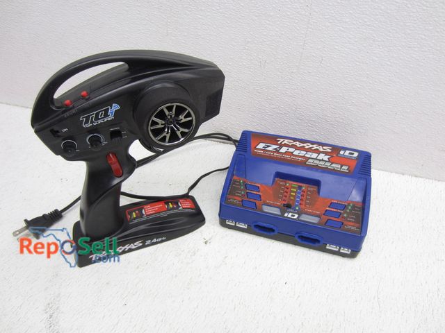 Lot 31-6203 - Traxxas Remote And Battery Charger - Power On