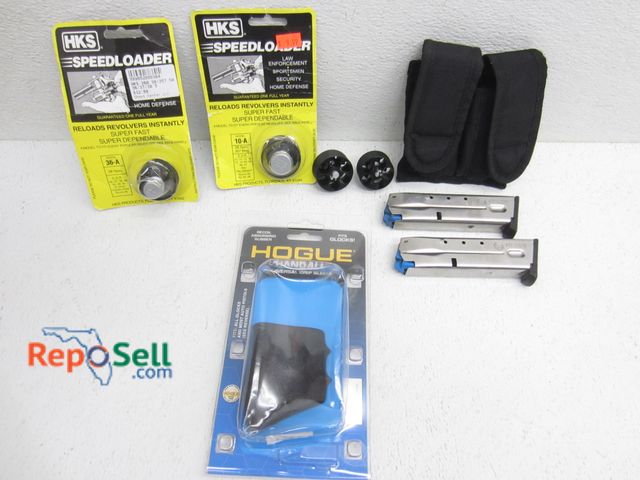 Lot 31-9325 - (2) .40 S&amp;W 4046 Magazines, Revolver Speedloaders, Grips etc