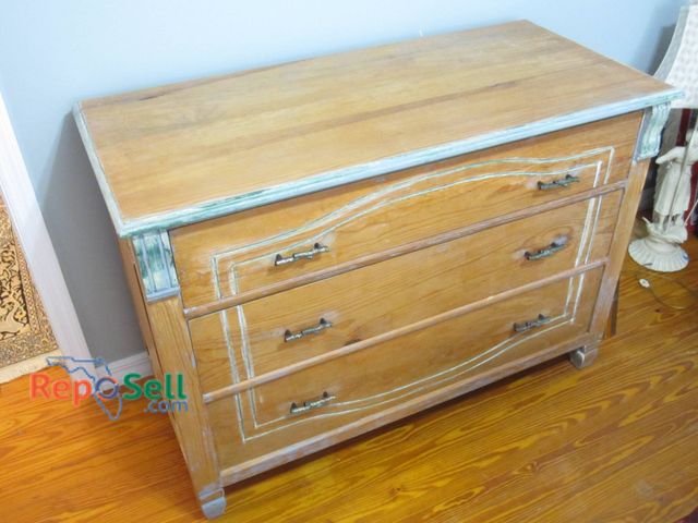 Lot 31-9016 - Wooden Three-Drawer Dresser Featuring Green Trim, Measuring 48 X 22 X 35 Inches.