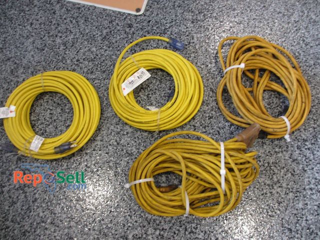 Lot 31-1178 - Four Yellow Extension Cords. Two Of The Extension Cords Appear New With Their Original Labels Attach...