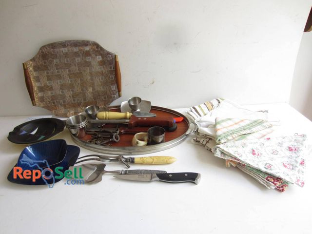 Lot 31-9195 - An embossed metal and wood serving tray, assorted stainless steel utensils, vintage-style keys, a se...