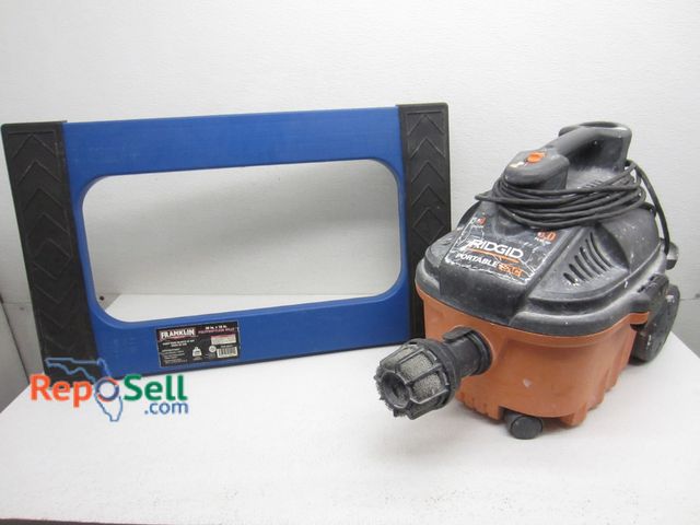 Lot 31-9236 - Ridgid Shop Vac And Floor Dolly - Power On