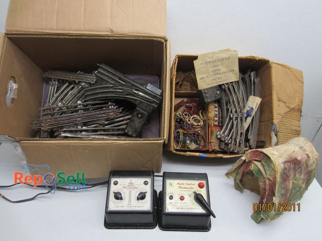 Lot 31-5153 - Lionel O Gauge Train Tracks &amp; 2 Transformers (Powered On)