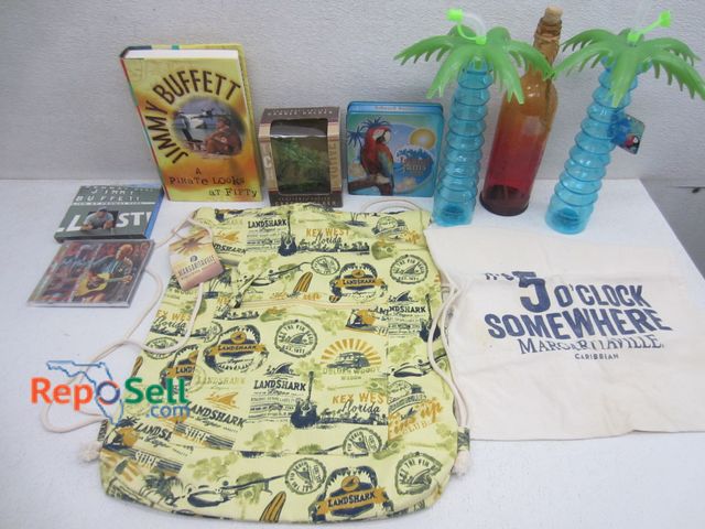 Lot 31-6280 - Jimmy Buffett collectible lot: CDs, decor, etc.
