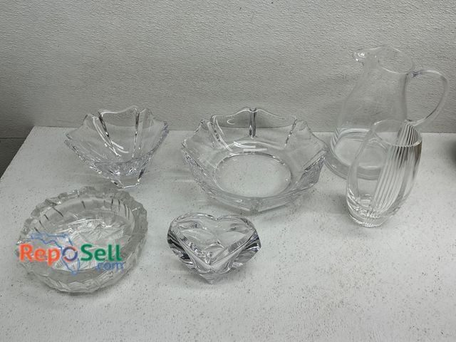 Lot 31-1405 - Six clear glass items: one water pitcher marked Rosenthal with a rounded design, a fluted glass bowl...