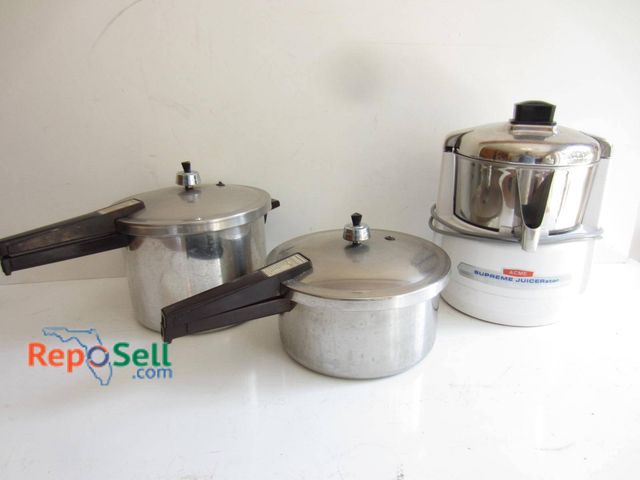 Lot 31-9182 - Includes two Presto aluminum pressure cookers with black plastic handles, featuring cooking guides o...