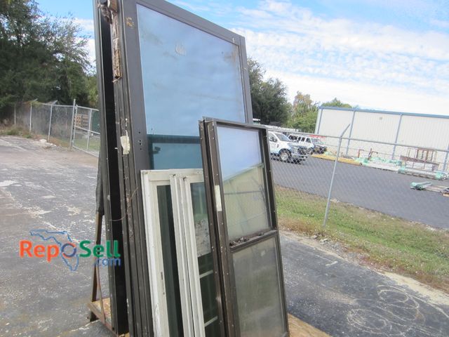 Lot 31-8358 - (16) Aluminum Window Inserts And Metal L-Shaped Glass Stand 6'x4'x66": (11) Are Sliding Glass Doors ...