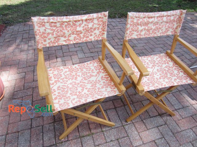 Lot 31-9203 - (2) Wooden folding director's chairs featuring light wood frames and fabric canvas seats and backres...