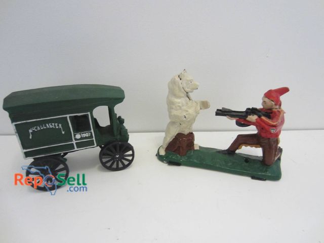 Lot 31-9081 - Painted Cast Iron Figures Featuring A McCallaster Wagon And A Hunter With Bear Scene.