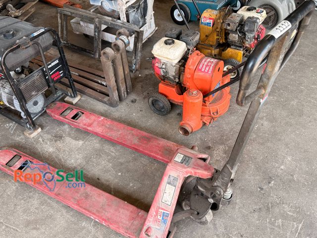 Lot 31-1112 - Red Industrial Pallet Jack - working when tested