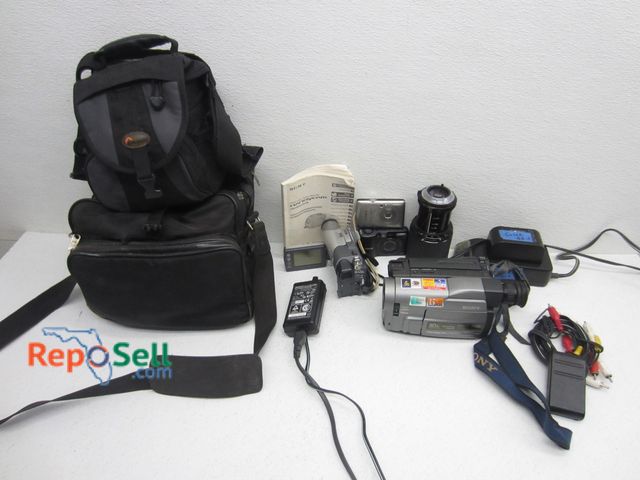 Lot 31-6491 - Lot Of (2) Camcorders, (2) Cameras, Battery, Lens And (2) Carry Cases: Sony And Canon