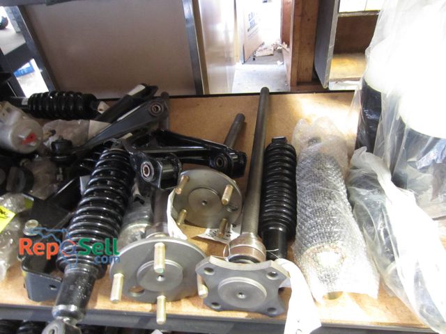 Lot 31-1057 - Contents Of 2 Shelves With Golf Cart Spindles, Rear Shocks, Hubs, And Suspension Parts