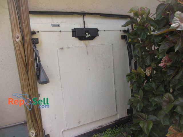 Lot 31-8376 - Used  2011 Toyota Tacoma 5' bed cover - Red With White Underside And Latch Mechanism - Approx 67" x ...
