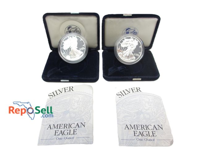 Lot 31-1016 - (2) 1 oz. Silver American Eagle "P" Proof Coins in Box with COA 1996 &amp; 1999
